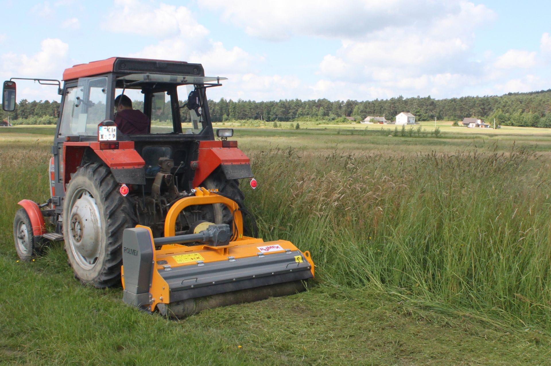 Rolmex flail mower cutting overgrown farmland